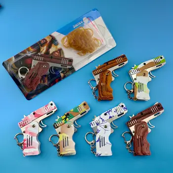Minden fém mini lehet hajtani, mint egy kulcstartó gumi fegyvert gyermek ajándék, játék hat tör gumi játék pisztoly játék gyűjtemény